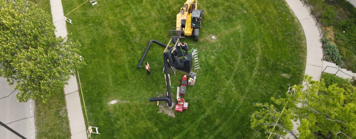 Overhead view of workers dismantling the Miss Nitro sculpture.