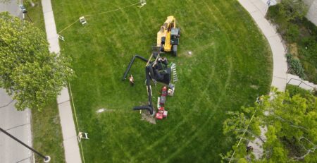 Overhead view of workers dismantling the Miss Nitro sculpture.