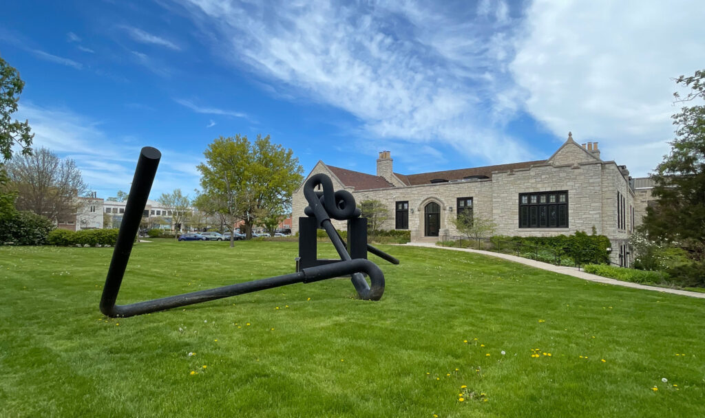 Wide angle view of the Miss Nitro sculpture facing the west end of the library.