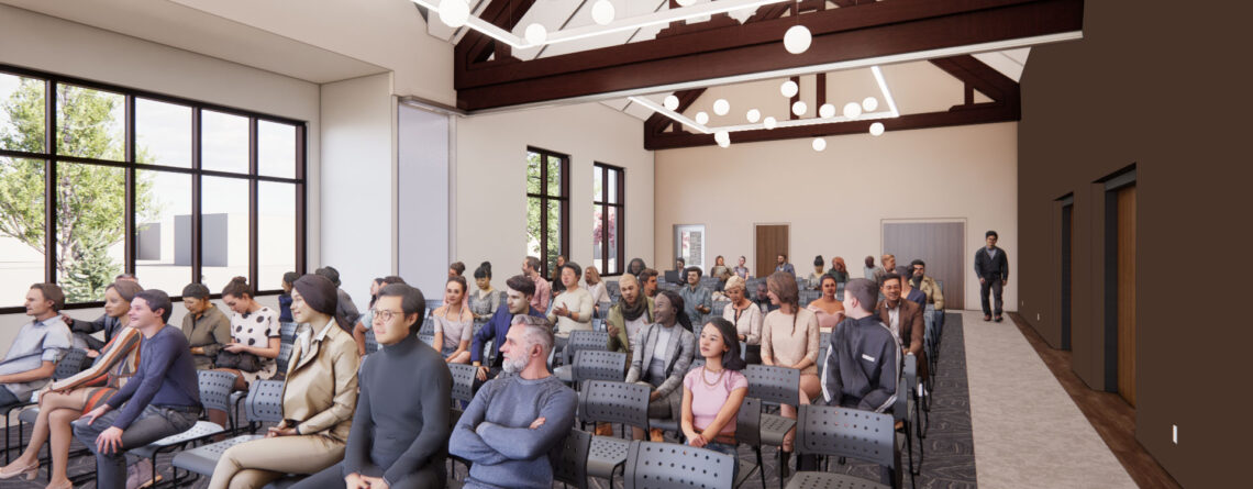 A computer generated image of a large meeting room with elaborate ceiling lighting and peaked ceiling. A group of computer-generated people are seated facing forward watching a program not in view.