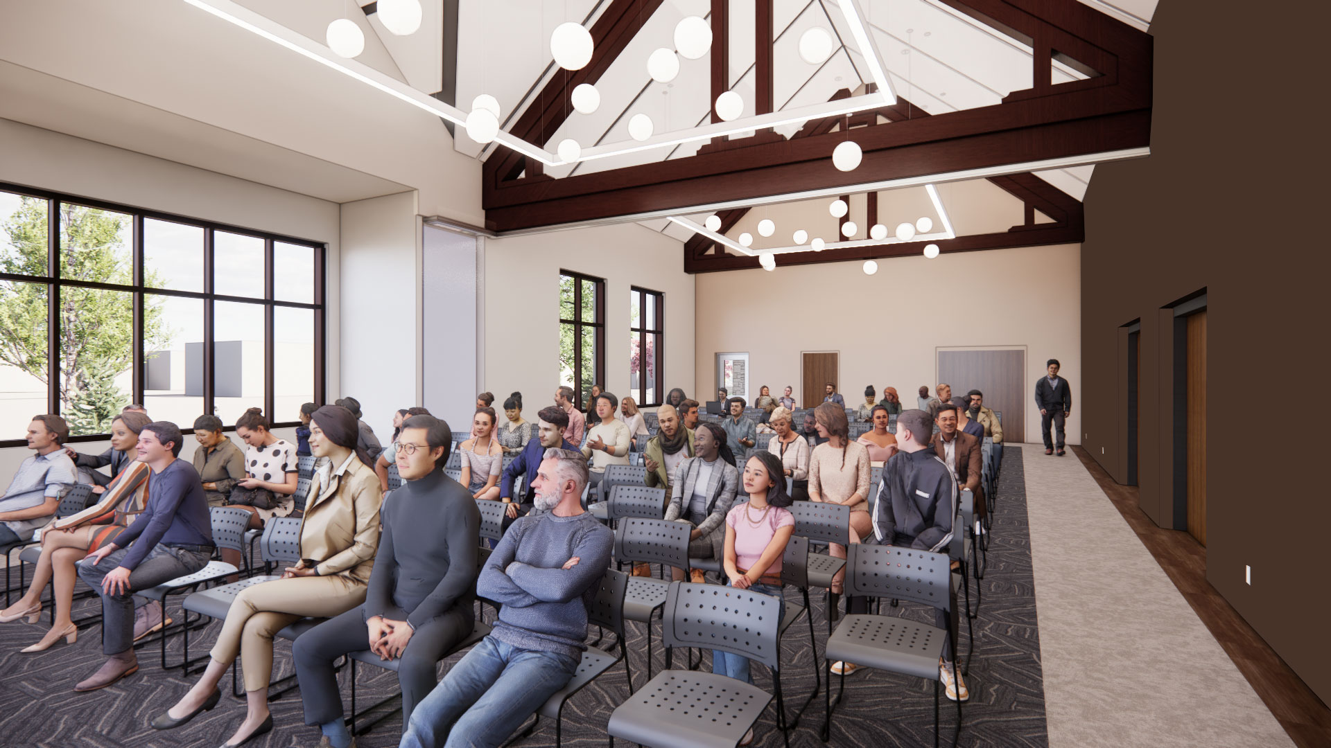 A computer generated image of a large meeting room with elaborate ceiling lighting and peaked ceiling. A group of computer-generated people are seated facing forward watching a program not in view.