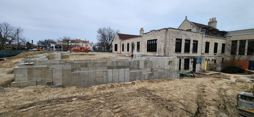 Wide angle shot of the new footings on the south end of the expansion, attached to the existing library.